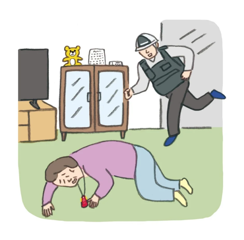 高齢者が転倒し介助される様子